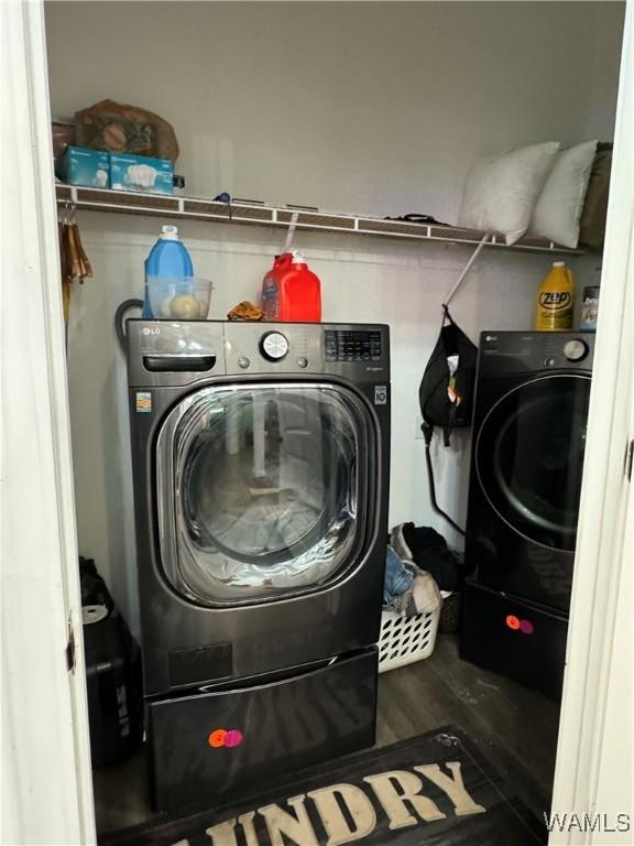 washroom with laundry area and wood finished floors