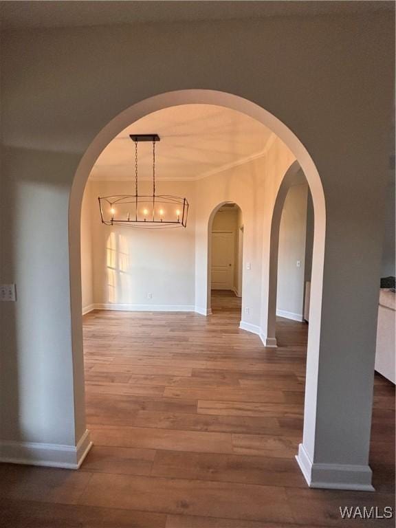 5203 Bristolwood Cir, Northport, AL 35475 - unfurnished dining area with wood finished floors and arched walkways