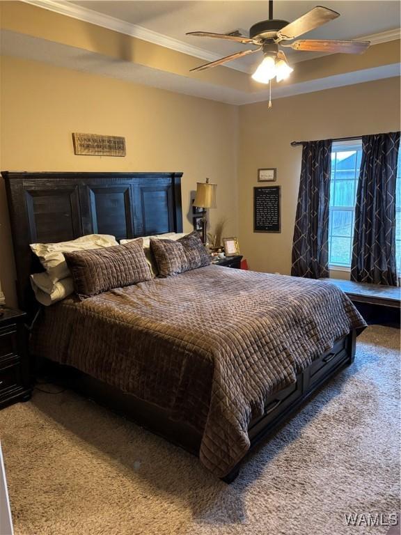 5203 Bristolwood Cir, Northport, AL 35475 - carpeted bedroom with crown molding and a ceiling fan