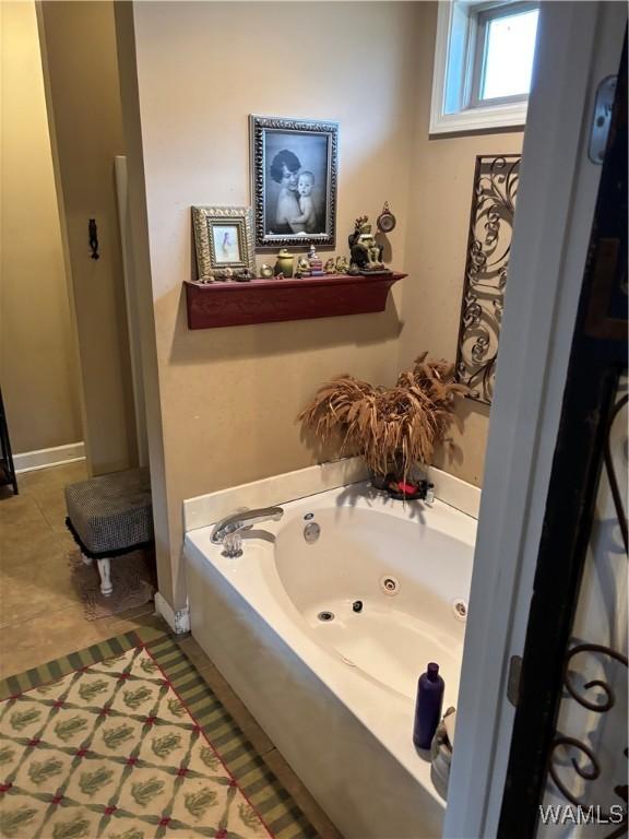 5203 Bristolwood Cir, Northport, AL 35475 - bathroom featuring a tub with jets and tile patterned floors