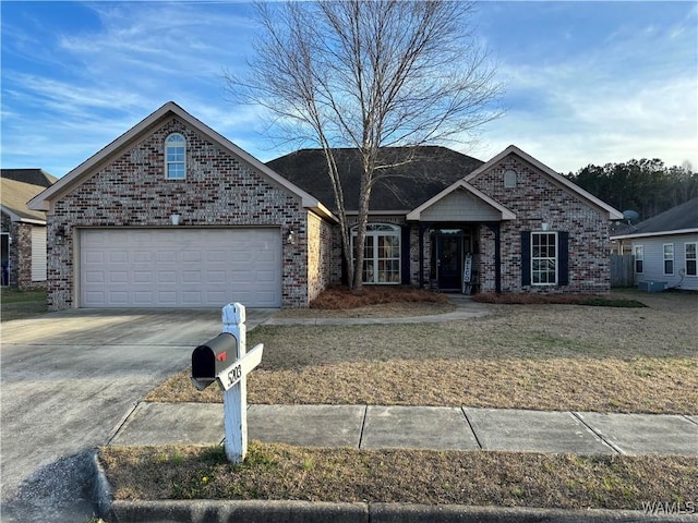 ranch-style house with brick siding, driveway, and a garage