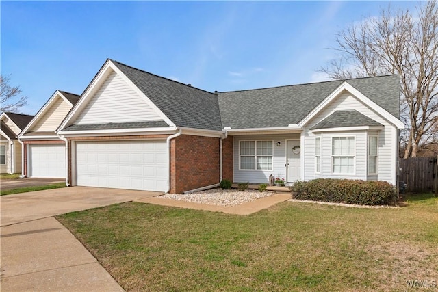 ranch-style house with brick siding, fence, a front yard, driveway, and an attached garage