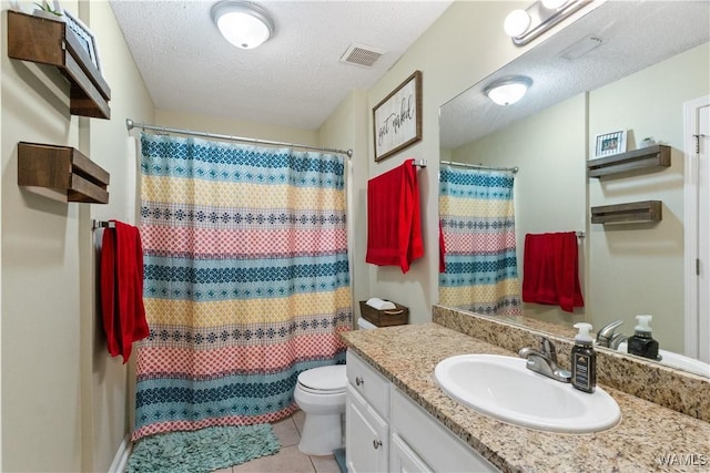 full bath featuring visible vents, toilet, a textured ceiling, tile patterned flooring, and vanity