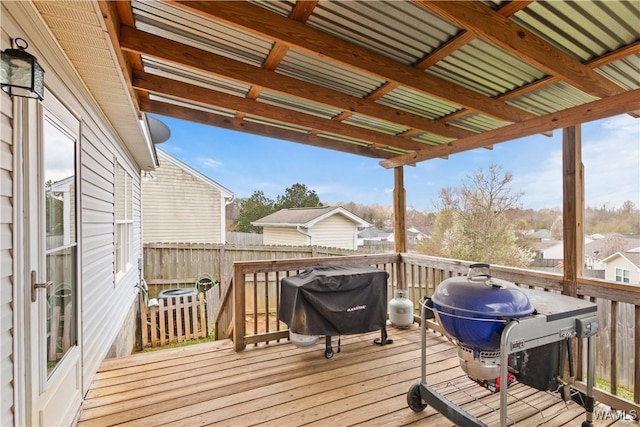 wooden terrace featuring a grill