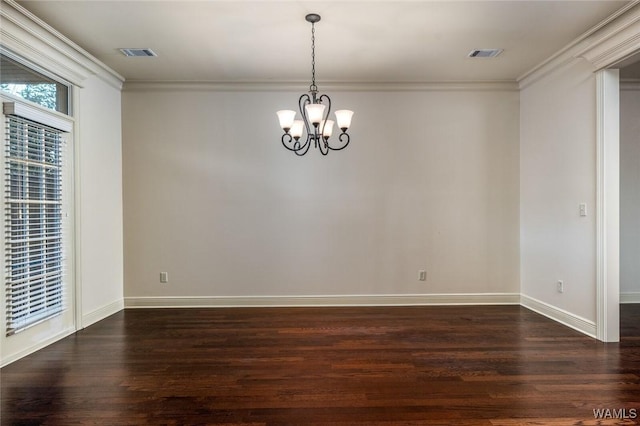 unfurnished room with ornamental molding, dark hardwood / wood-style floors, and an inviting chandelier