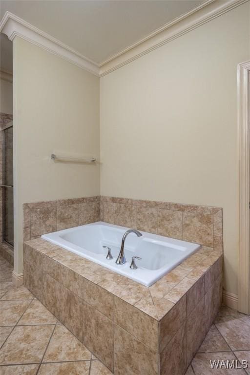 bathroom featuring tile patterned floors, tiled bath, and crown molding