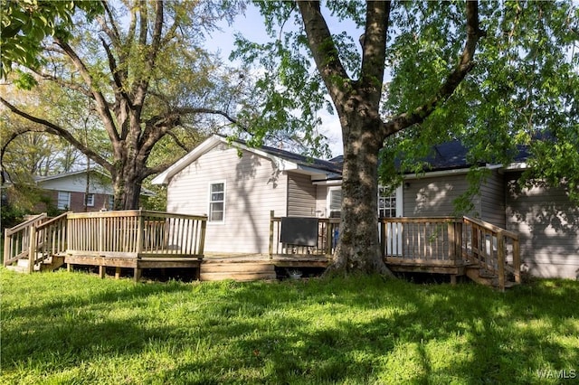2516 17th Ave, Northport, AL 35476 - rear view of house featuring a deck and a yard