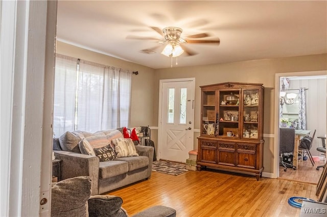 2516 17th Ave, Northport, AL 35476 - living area featuring a ceiling fan and wood finished floors