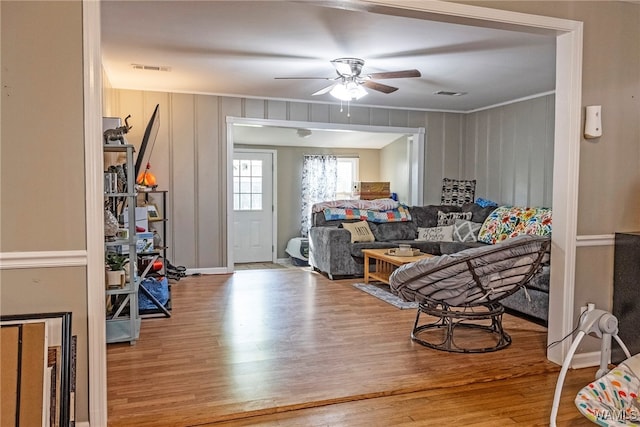 2516 17th Ave, Northport, AL 35476 - living room with a ceiling fan, visible vents, ornamental molding, and wood finished floors