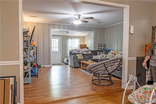 2516 17th Ave, Northport, AL 35476 - living area with visible vents, ceiling fan, wood finished floors, and ornamental molding