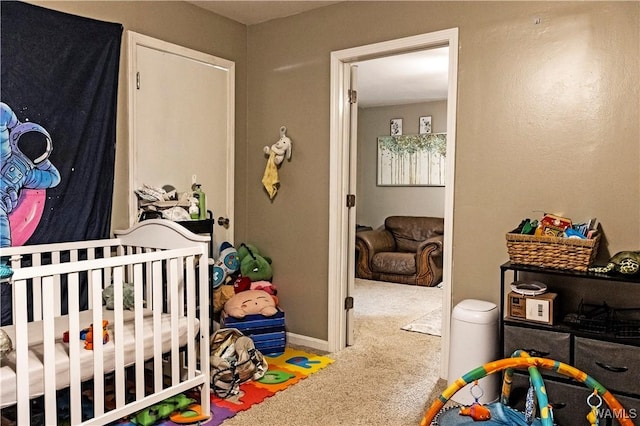2516 17th Ave, Northport, AL 35476 - carpeted bedroom featuring baseboards and a nursery area