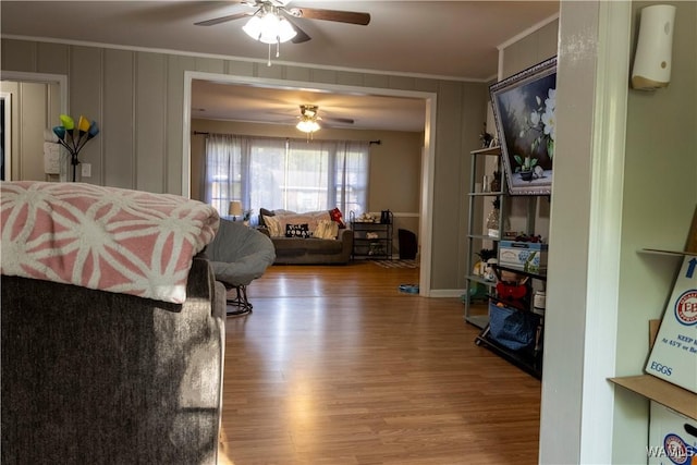 2516 17th Ave, Northport, AL 35476 - interior space featuring a decorative wall, crown molding, a ceiling fan, and wood finished floors