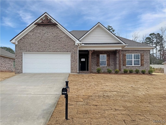 view of front of house with a garage and a front lawn