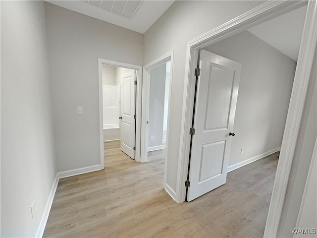 hall with light hardwood / wood-style flooring