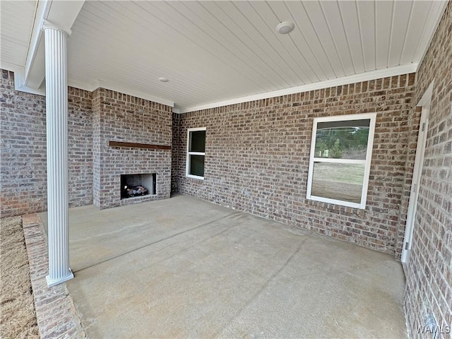 view of patio / terrace with a large fireplace