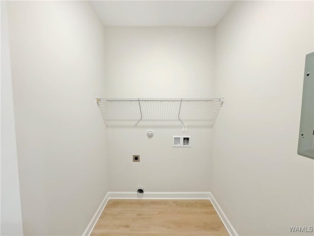 laundry area featuring gas dryer hookup, wood-type flooring, hookup for an electric dryer, and hookup for a washing machine