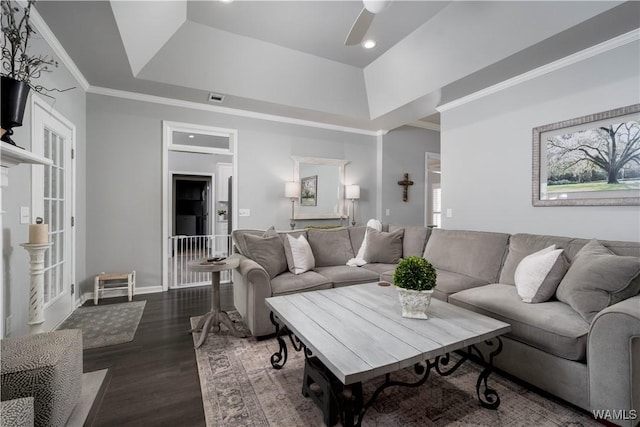 2603 Lauren St, Northport, AL 35475 - living room featuring a ceiling fan, dark wood finished floors, ornamental molding, a tray ceiling, and baseboards