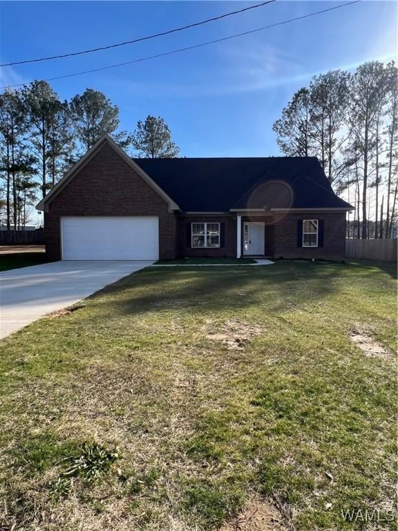 ranch-style home with a garage and a front lawn