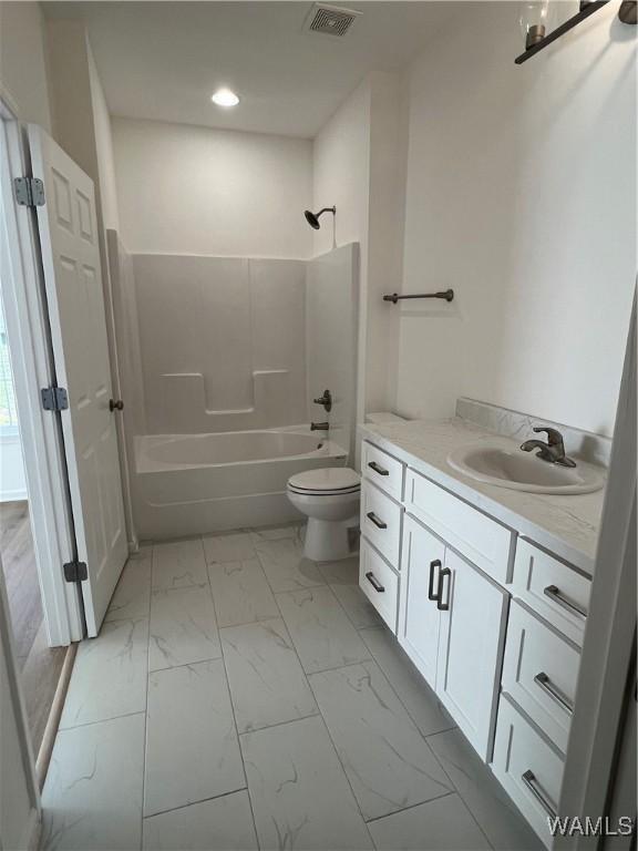 full bathroom with toilet, washtub / shower combination, and vanity