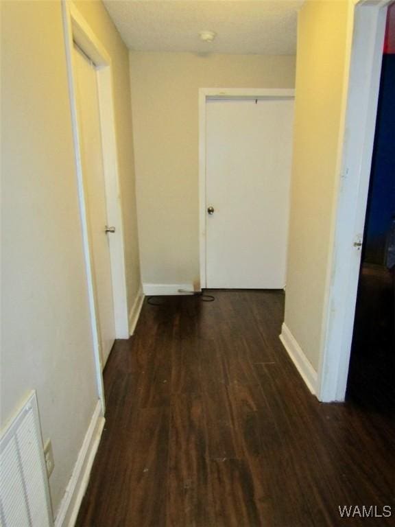 205 S Ash Ave, Demopolis, AL 36732 - corridor featuring wood finished floors and baseboards