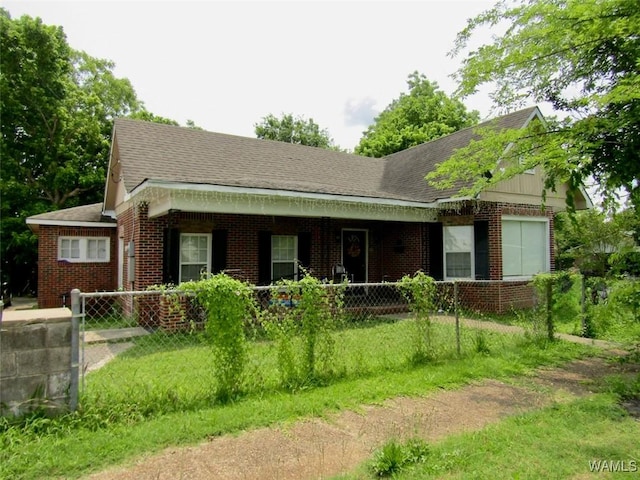 205 S Ash Ave, Demopolis, AL 36732 - view of front of home featuring brick siding, covered porch, and a shingled roof