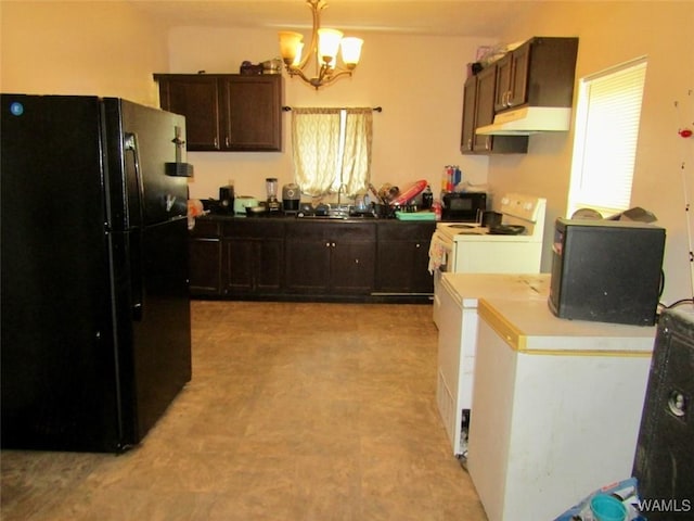 205 S Ash Ave, Demopolis, AL 36732 - kitchen with black appliances, a chandelier, under cabinet range hood, dark brown cabinets, and pendant lighting