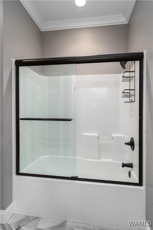 12030 Orlea Ln, Northport, AL 35475 - full bath featuring ornamental molding, combined bath / shower with glass door, and marble look tile flooring