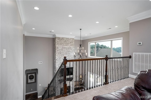 12030 Orlea Ln, Northport, AL 35475 - hallway featuring a chandelier, recessed lighting, baseboards, ornamental molding, and an upstairs landing