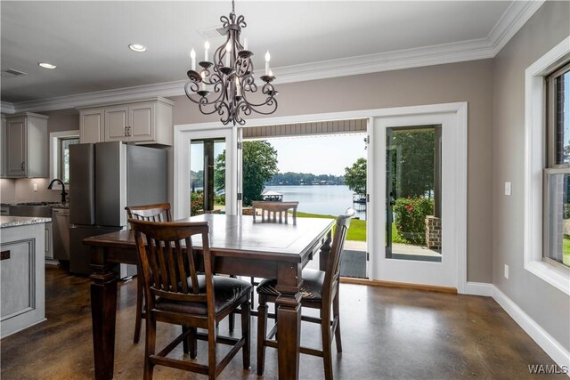 12030 Orlea Ln, Northport, AL 35475 - dining room featuring concrete floors, baseboards, a chandelier, ornamental molding, and recessed lighting