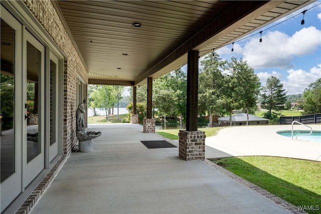 12030 Orlea Ln, Northport, AL 35475 - view of patio featuring an outdoor pool and a water view