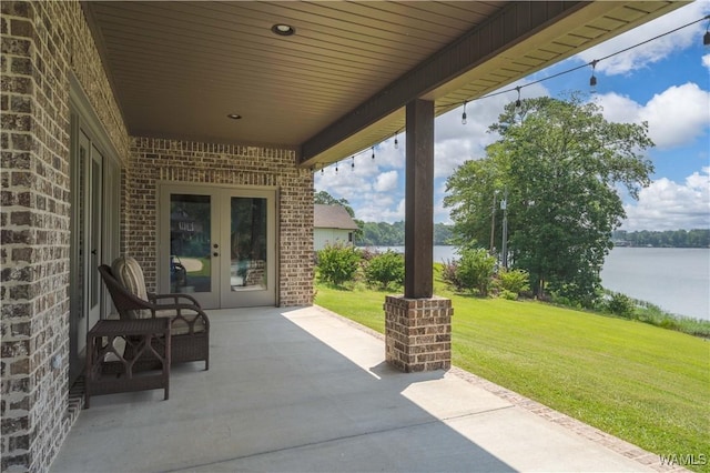 12030 Orlea Ln, Northport, AL 35475 - view of patio / terrace with french doors and a water view