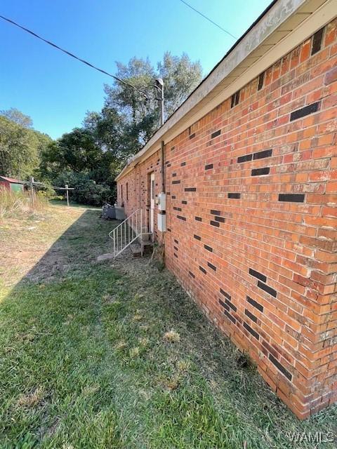 view of property exterior featuring a lawn