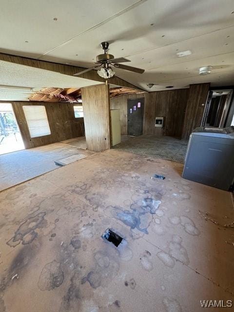 interior space with washer / dryer and wood walls