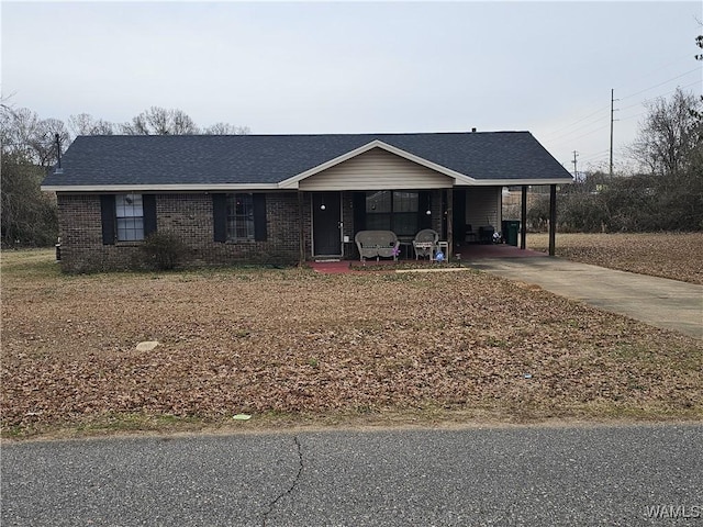 single story home featuring a carport