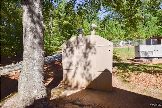 view of storm shelter featuring a shed