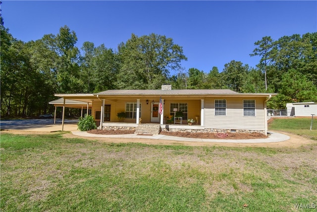 ranch-style house featuring a porch, a front yard, and a carport