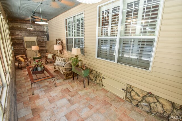 exterior space featuring ceiling fan and an outdoor living space