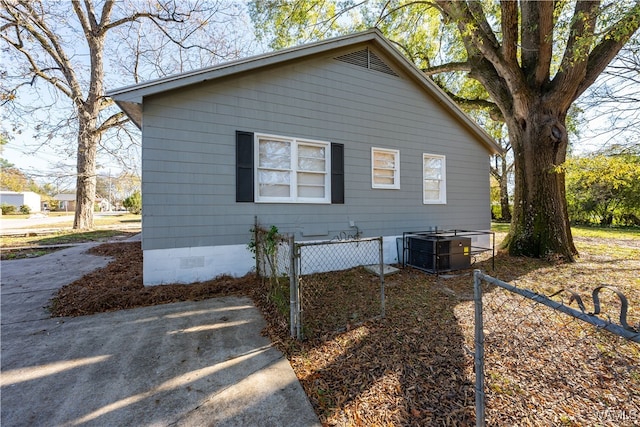 view of side of property with central AC unit