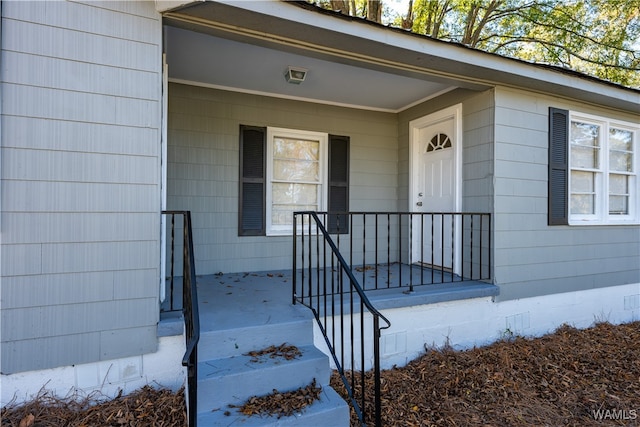 doorway to property featuring a porch