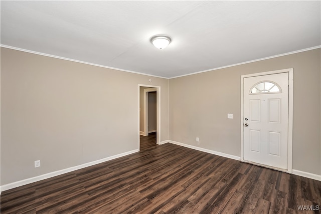 foyer featuring crown molding and dark wood-type flooring