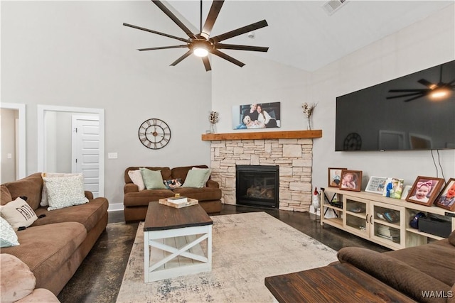 12625 Northside Rd, Northport, AL 35475 - living room featuring ceiling fan, high vaulted ceiling, a fireplace, wood finished floors, and baseboards