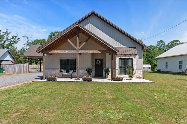 12625 Northside Rd, Northport, AL 35475 - view of front facade with stone siding, gravel driveway, and covered porch