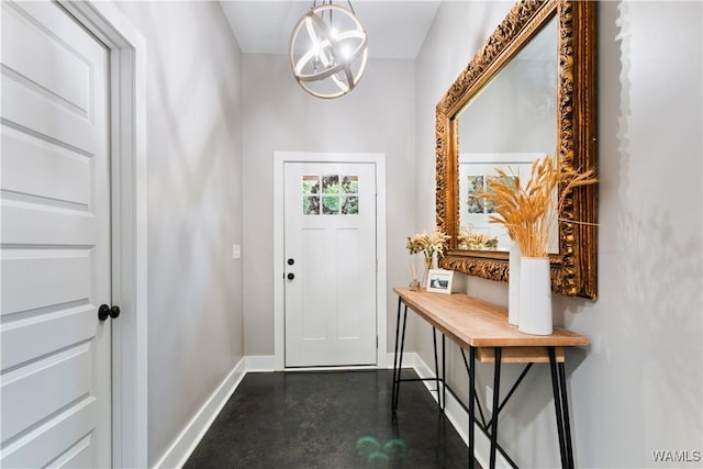 12625 Northside Rd, Northport, AL 35475 - foyer with baseboards, finished concrete flooring, and a chandelier