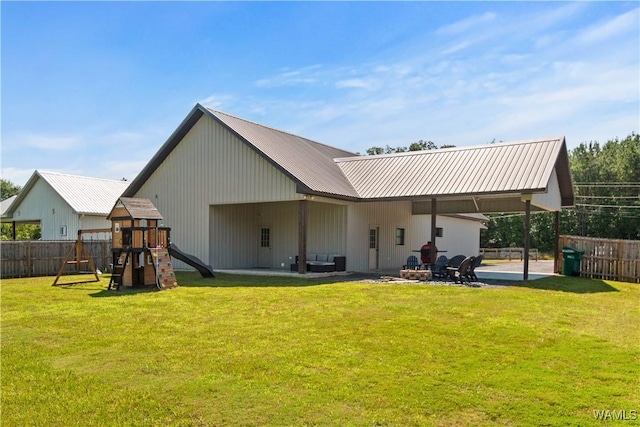 12625 Northside Rd, Northport, AL 35475 - back of property with a playground, a patio area, and metal roof