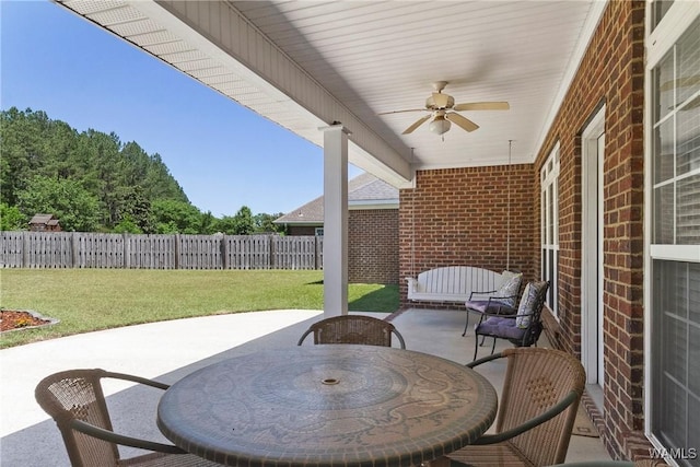 view of patio featuring a fenced backyard and a ceiling fan