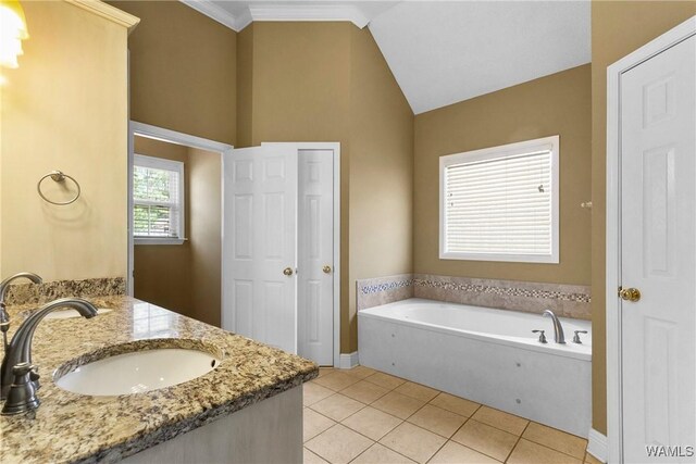 bathroom with lofted ceiling, double vanity, a sink, tile patterned flooring, and a bath