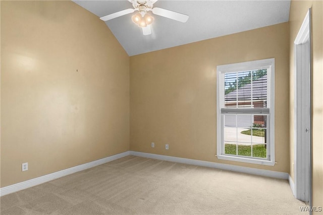 unfurnished room with a wealth of natural light, light carpet, and lofted ceiling