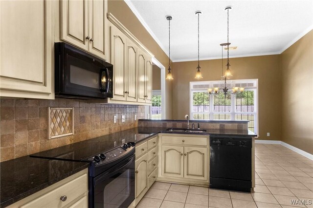 kitchen with crown molding, a peninsula, cream cabinetry, black appliances, and a sink