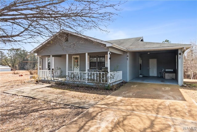 view of front of house with a carport and covered porch