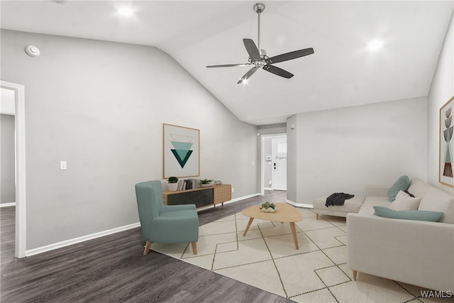 living room with ceiling fan, wood-type flooring, and lofted ceiling